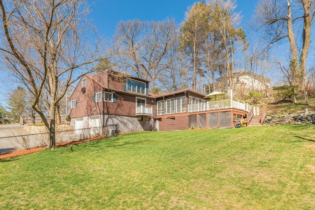 382 Worcester Street Wellesley, MA 02481 - Photo 20 of 22 a view of a house with a big yard and large tree
