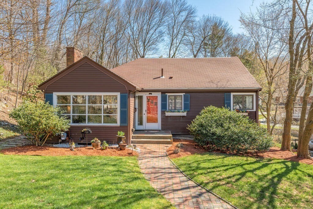 382 Worcester Street Wellesley, MA 02481 - Photo 21 of 22 a front view of a house with garden