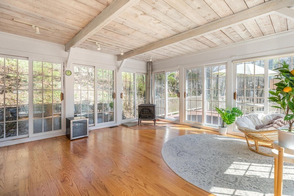 382 Worcester Street Wellesley, MA 02481 - Photo 9 of 22 a living room with furniture and large windows