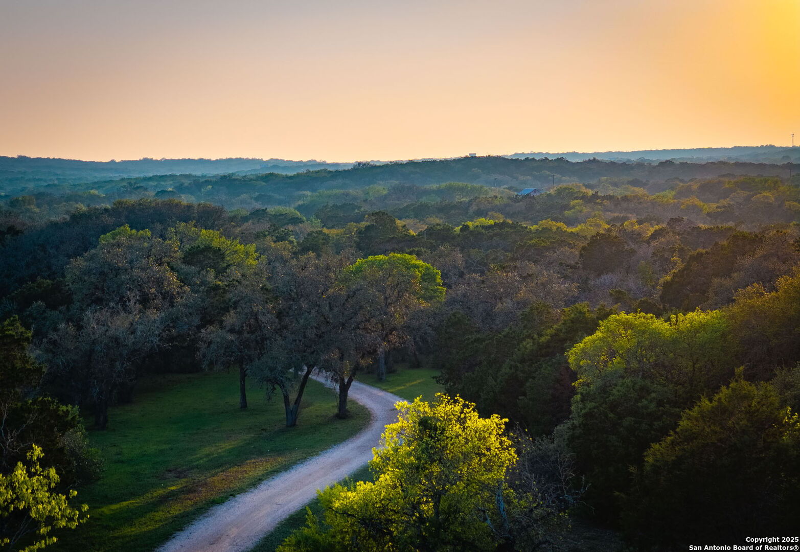 200 Elm Creek Road New Braunfels, TX 78132 - Photo 2 of 45 a view of a lake with a mountain in the background