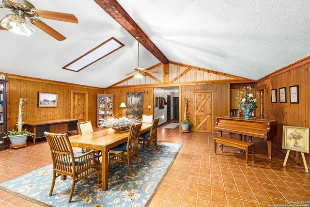 an outdoor space with lots of tables and chairs