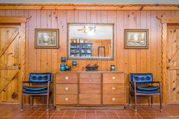 a living room with a bed and furniture