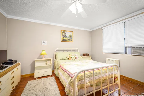 a bedroom with a bed and a window in it