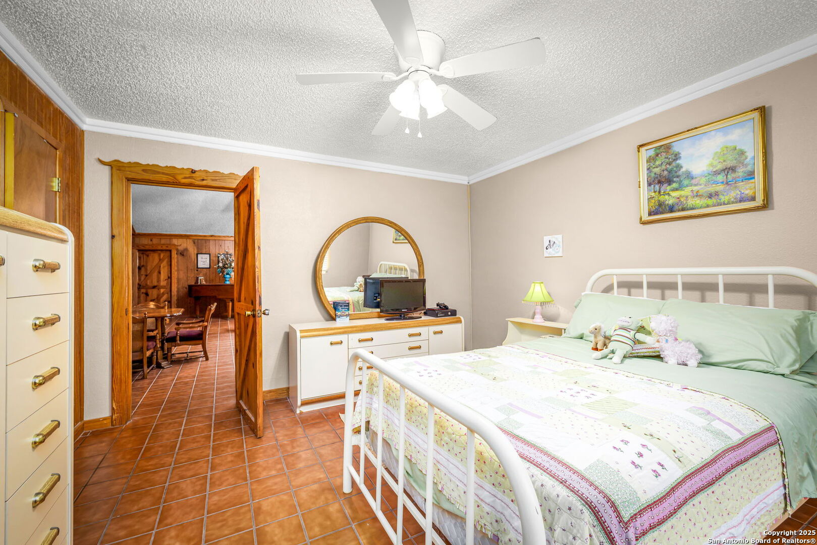 200 Elm Creek Road New Braunfels, TX 78132 - Photo 35 of 45 a large bedroom with a bed and a chandelier