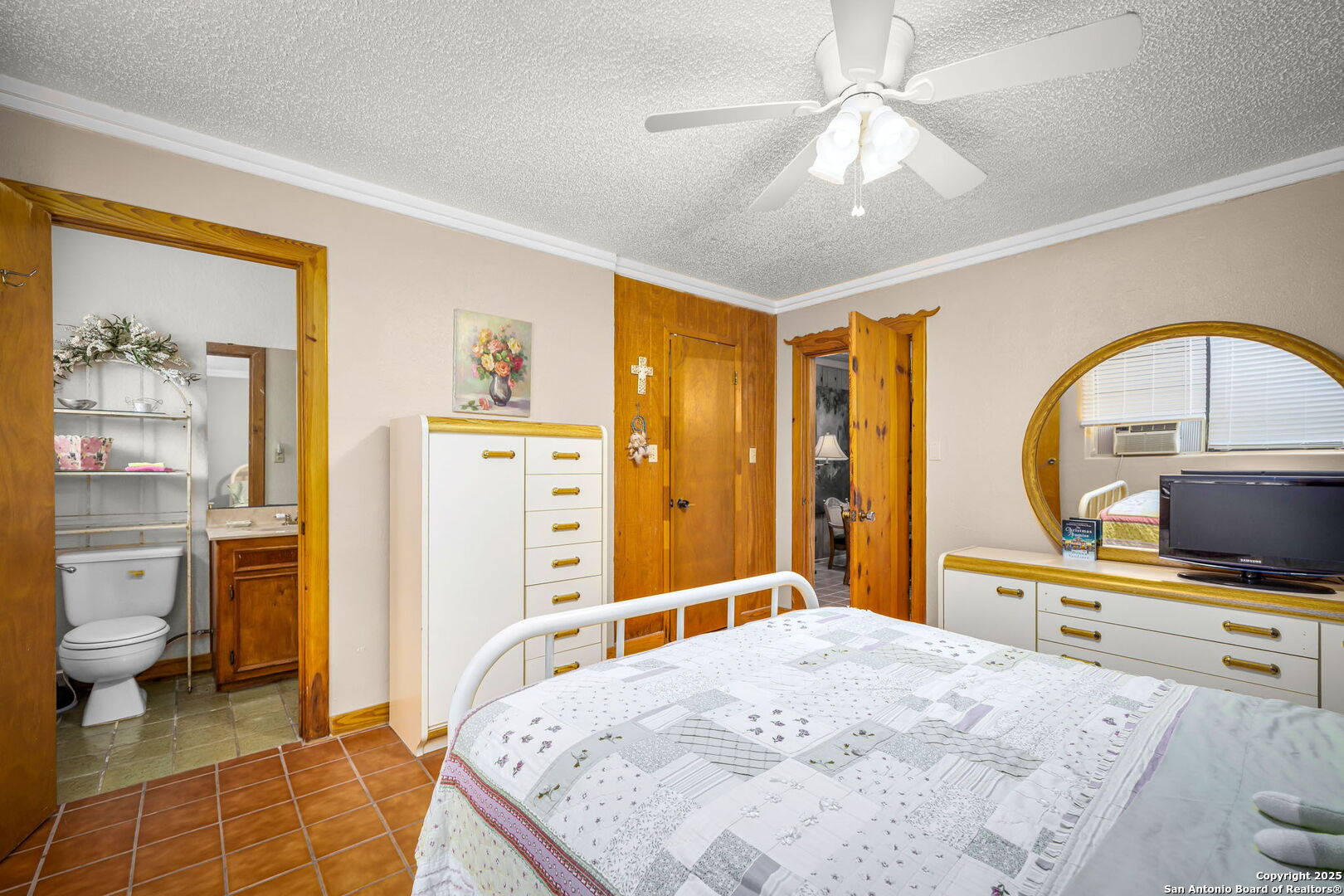 200 Elm Creek Road New Braunfels, TX 78132 - Photo 36 of 45 a bedroom with a bed a flat screen tv and balcony view