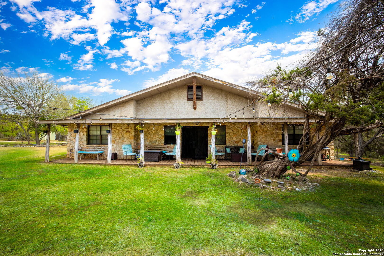 200 Elm Creek Road New Braunfels, TX 78132 - Photo 5 of 45 a view of a house with a yard porch and sitting area