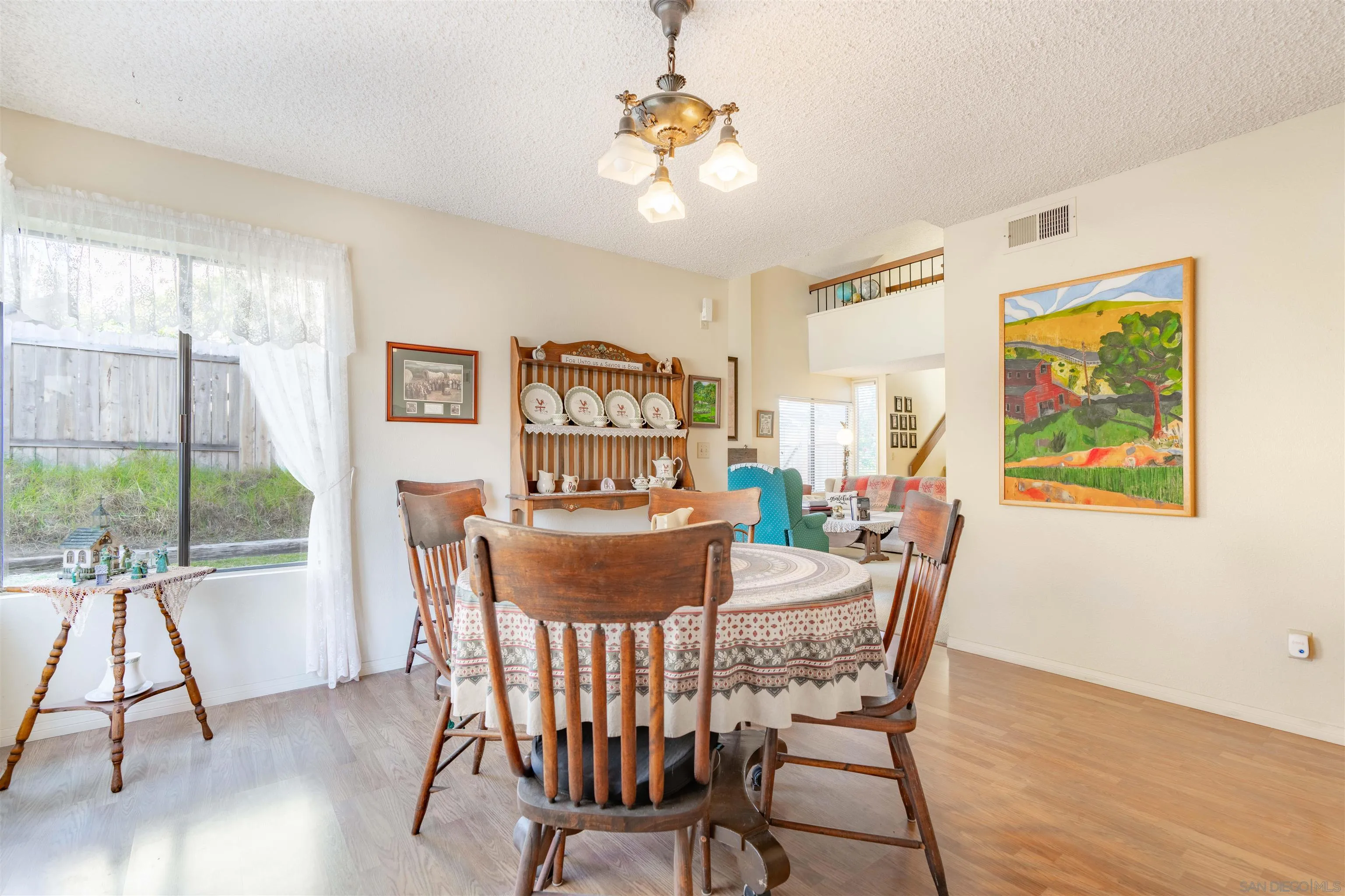 1440 Valleda Lane Encinitas, CA 92024 - Photo 12 of 54 a dining room with furniture and wooden floor