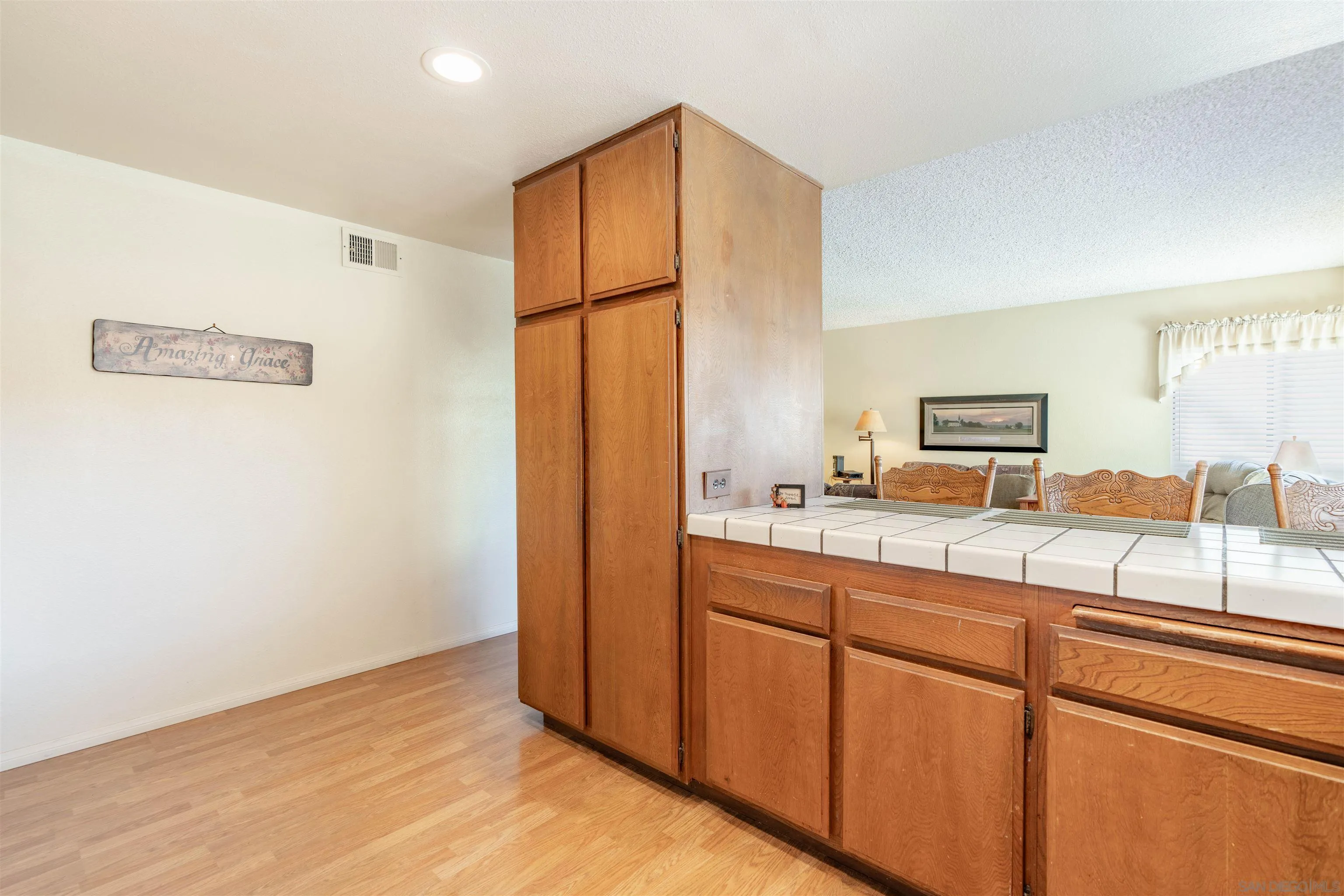 1440 Valleda Lane Encinitas, CA 92024 - Photo 17 of 54 a kitchen with stainless steel appliances granite countertop a refrigerator and a sink