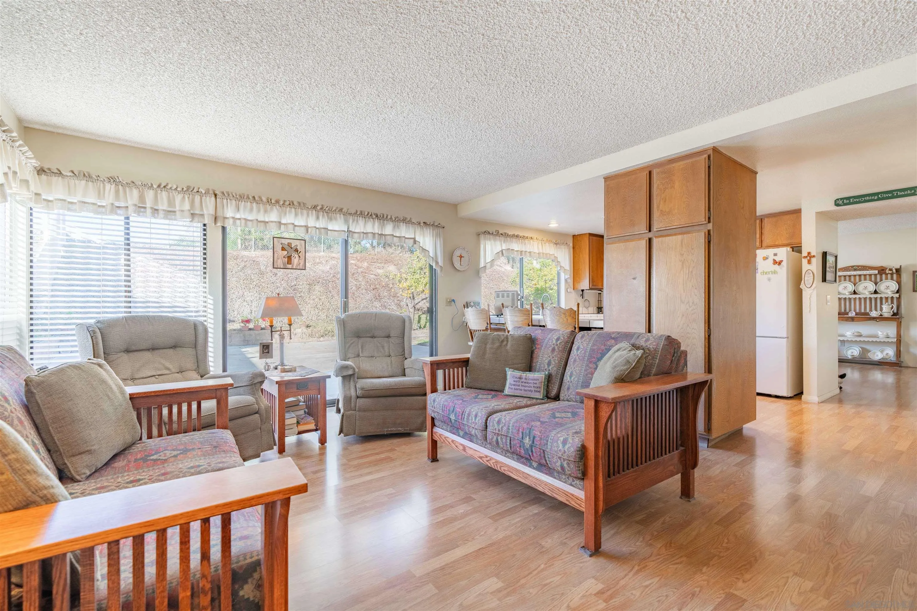 1440 Valleda Lane Encinitas, CA 92024 - Photo 20 of 54 a living room with furniture and a large window