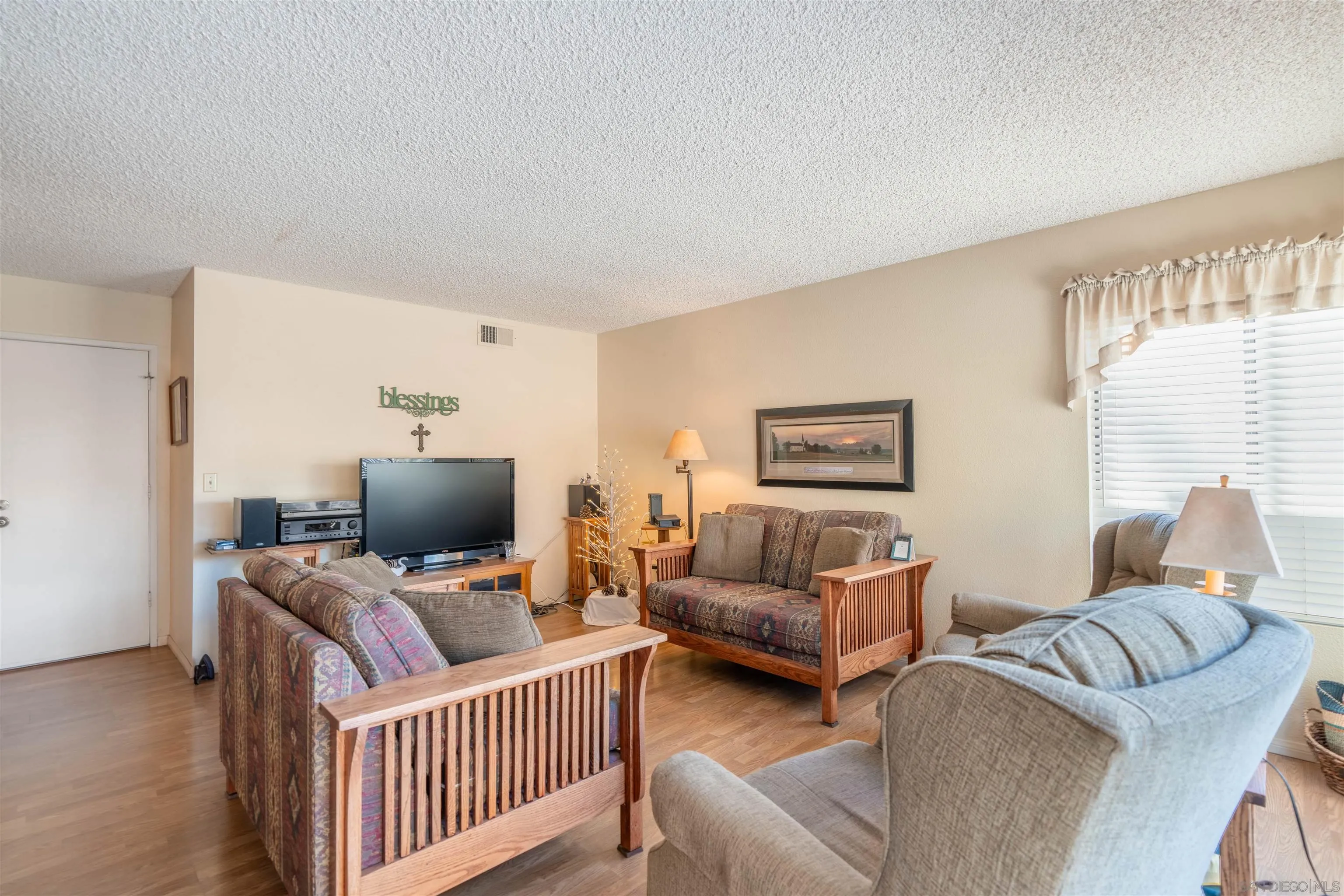 1440 Valleda Lane Encinitas, CA 92024 - Photo 21 of 54 a living room with furniture and a window