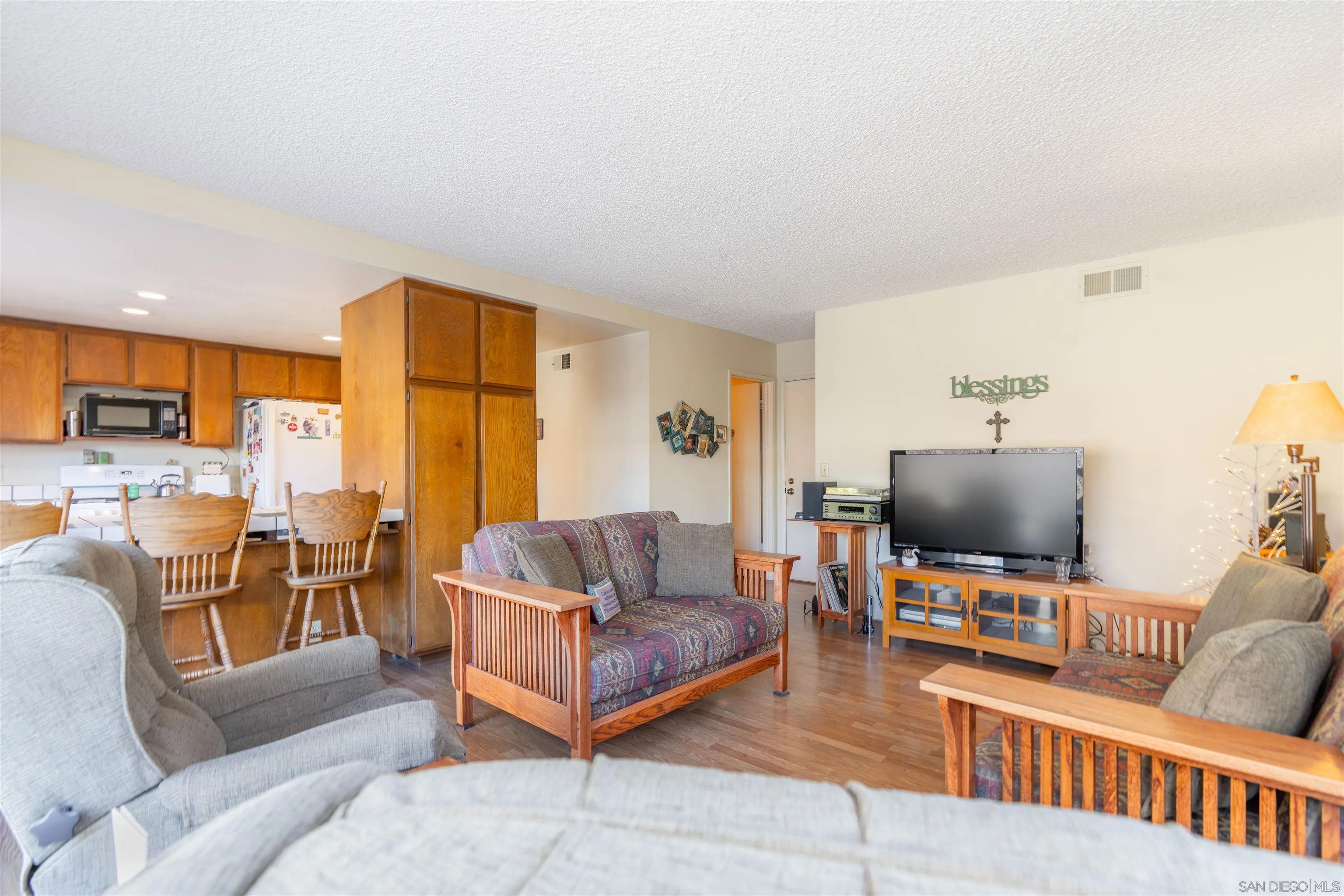 1440 Valleda Lane Encinitas, CA 92024 - Photo 22 of 54 a living room with furniture and a flat screen tv