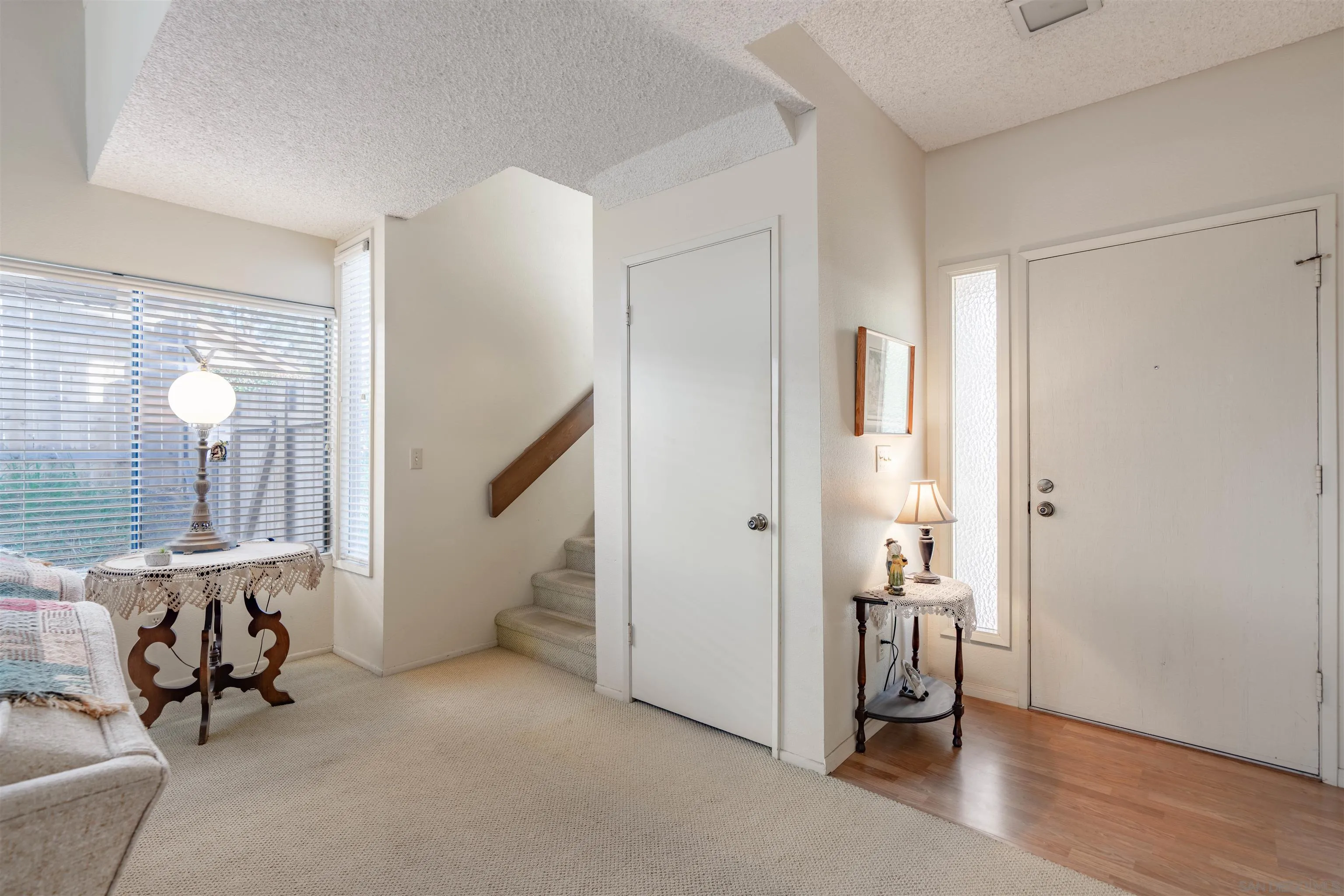 1440 Valleda Lane Encinitas, CA 92024 - Photo 10 of 54 a view of an empty room with a window and wooden floor