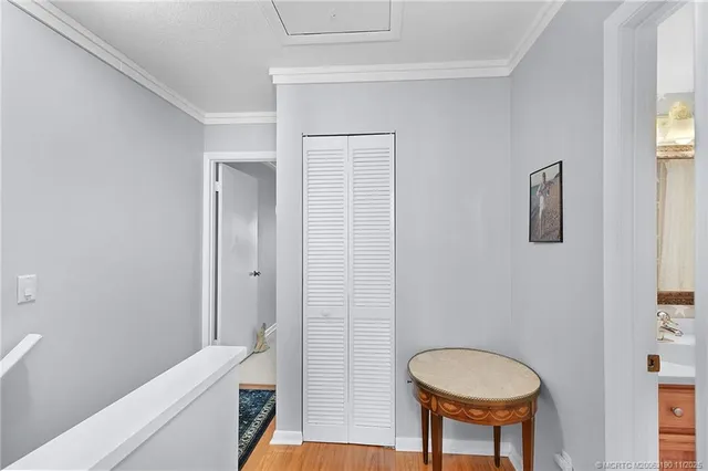 a bedroom with a bed and a night stand