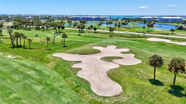 a view of houses with swimming pool and outdoor seating