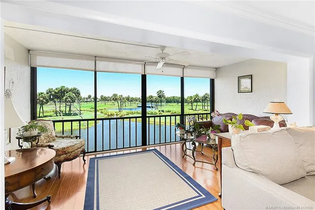 a spacious bathroom with a sink a mirror a bathtub and next to a window