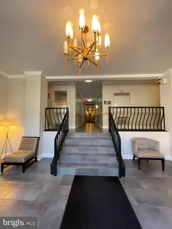 a view of entryway livingroom and hall with wooden floor