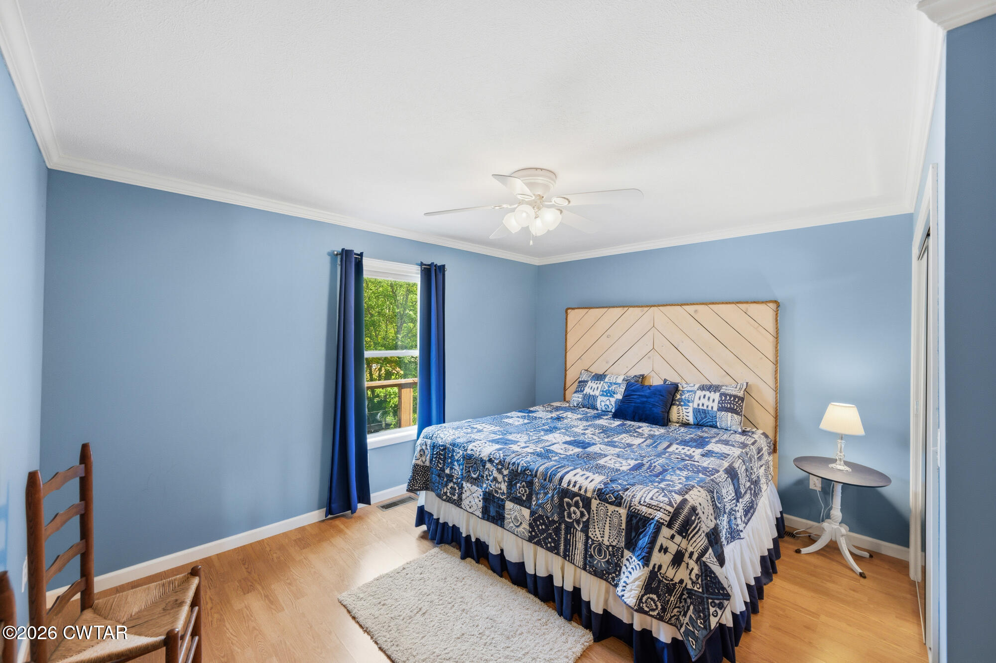 1728 Yarbro Landing Lane Decaturville, TN 38329 - Photo 11 of 44 a bedroom with a bed and a chandelier