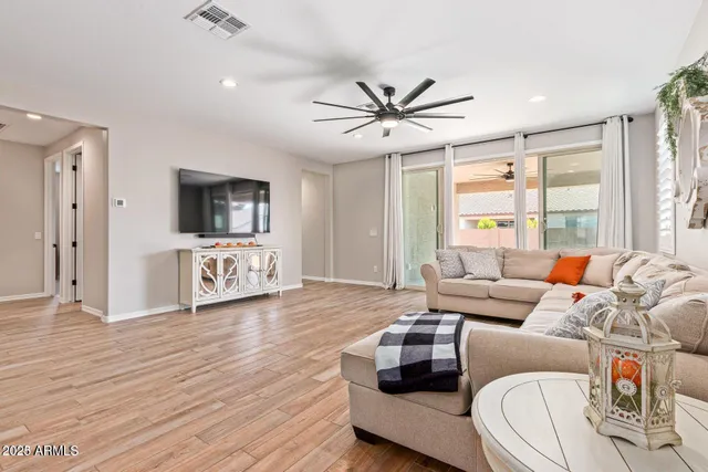 a book shelf with water and lots of books
