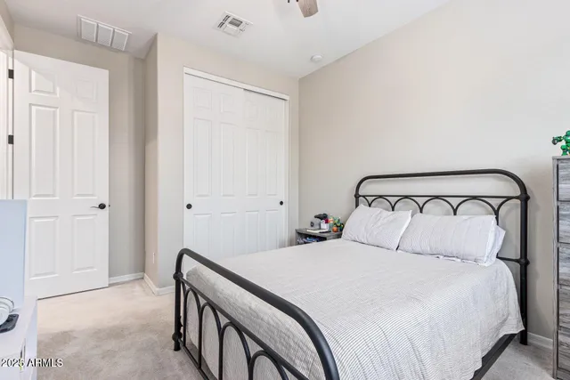 a bed room with a bed and a chandelier