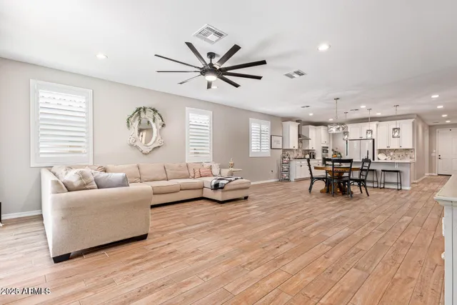 a kitchen with kitchen island a sink a counter top space appliances and cabinets