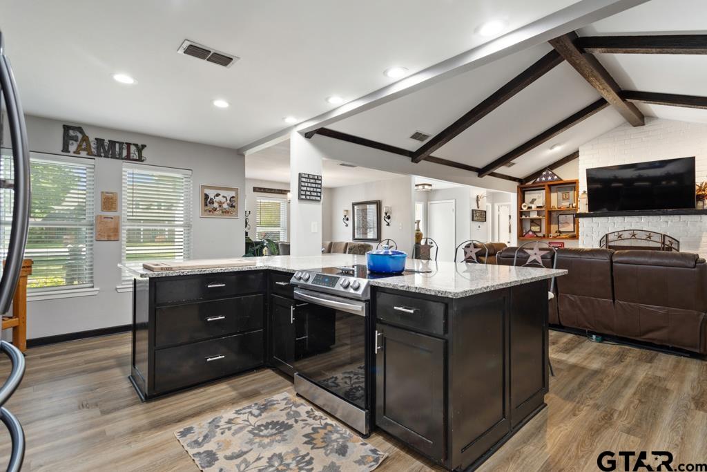 106 Ridgecrest Circle Bullard, TX 75757 - Photo 12 of 32 a kitchen with granite countertop a sink and a stove top oven
