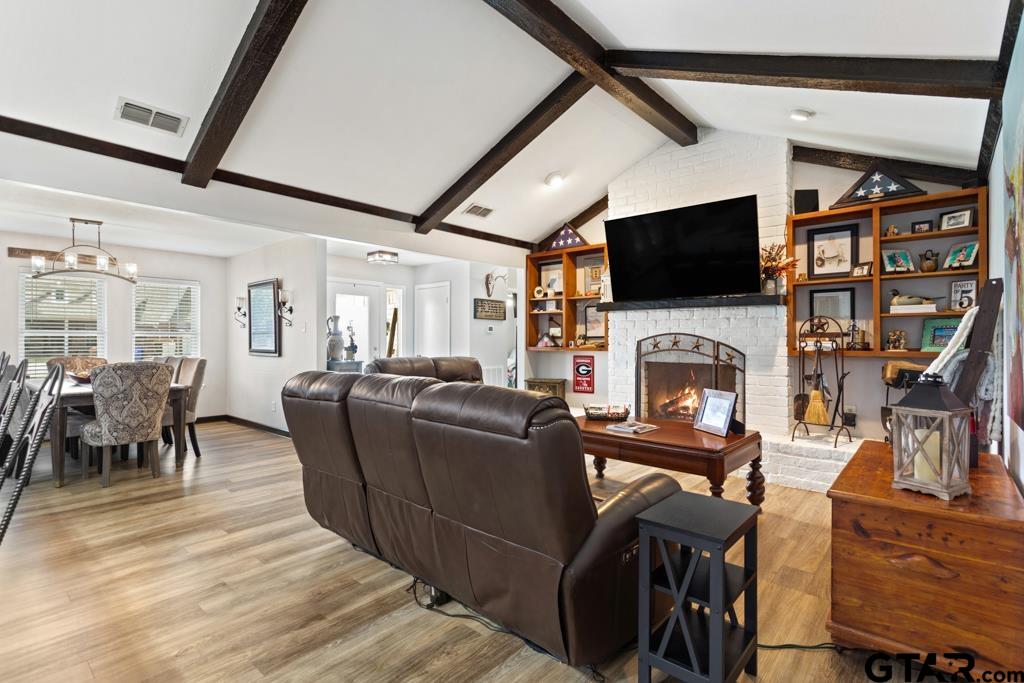 106 Ridgecrest Circle Bullard, TX 75757 - Photo 15 of 32 a living room with furniture a flat screen tv and a fireplace