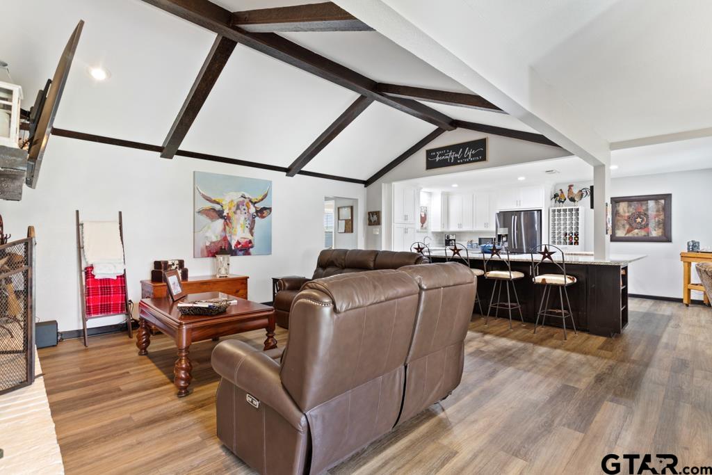 106 Ridgecrest Circle Bullard, TX 75757 - Photo 17 of 32 a living room with furniture and a wooden floor