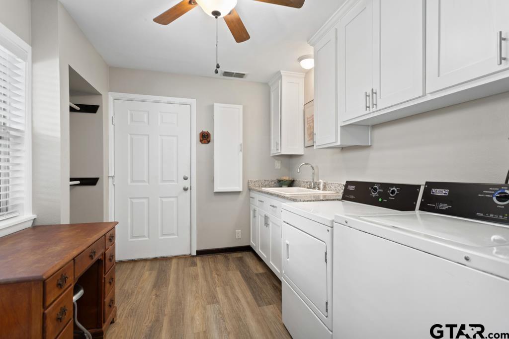 106 Ridgecrest Circle Bullard, TX 75757 - Photo 19 of 32 a kitchen with granite countertop a sink a stove and cabinets