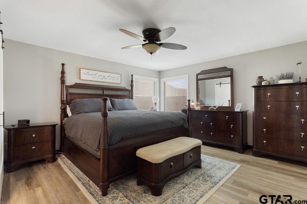 106 Ridgecrest Circle Bullard, TX 75757 - Photo 24 of 32 a bedroom with a bed and a dresser