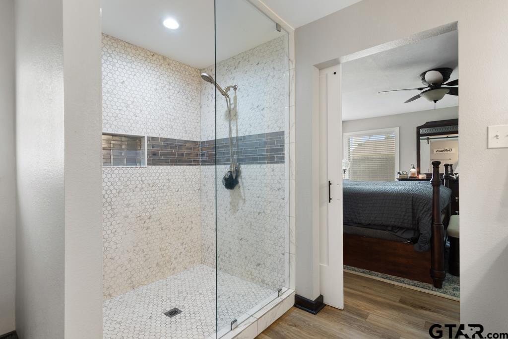 106 Ridgecrest Circle Bullard, TX 75757 - Photo 25 of 32 a bathroom with a shower and a glass door