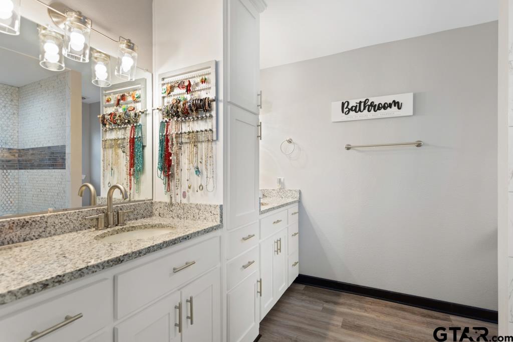 106 Ridgecrest Circle Bullard, TX 75757 - Photo 26 of 32 a bathroom with a sink and a mirror