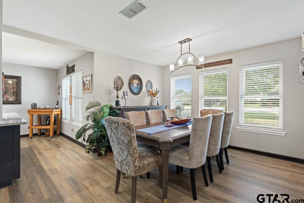 106 Ridgecrest Circle Bullard, TX 75757 - Photo 8 of 32 a view of a dining room with furniture window and wooden floor