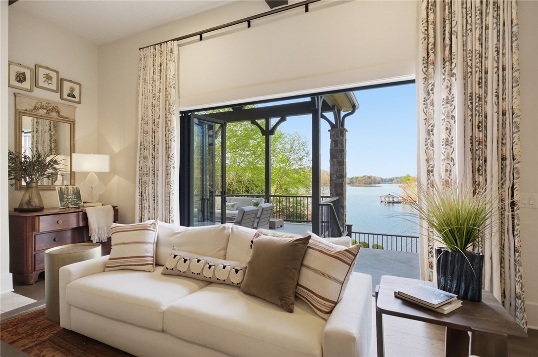 226 Long Ridge Road Sunset, SC 29685 - Photo 11 of 50 This living room seamlessly extends to a spacious patio, offering breathtaking waterfront views.