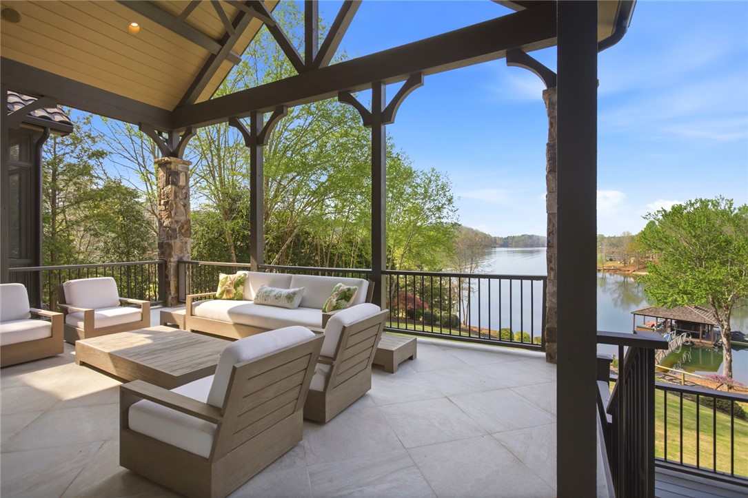 226 Long Ridge Road Sunset, SC 29685 - Photo 12 of 50 This outdoor patio offers serene lake views, perfect for peaceful enjoyment and outdoor living.