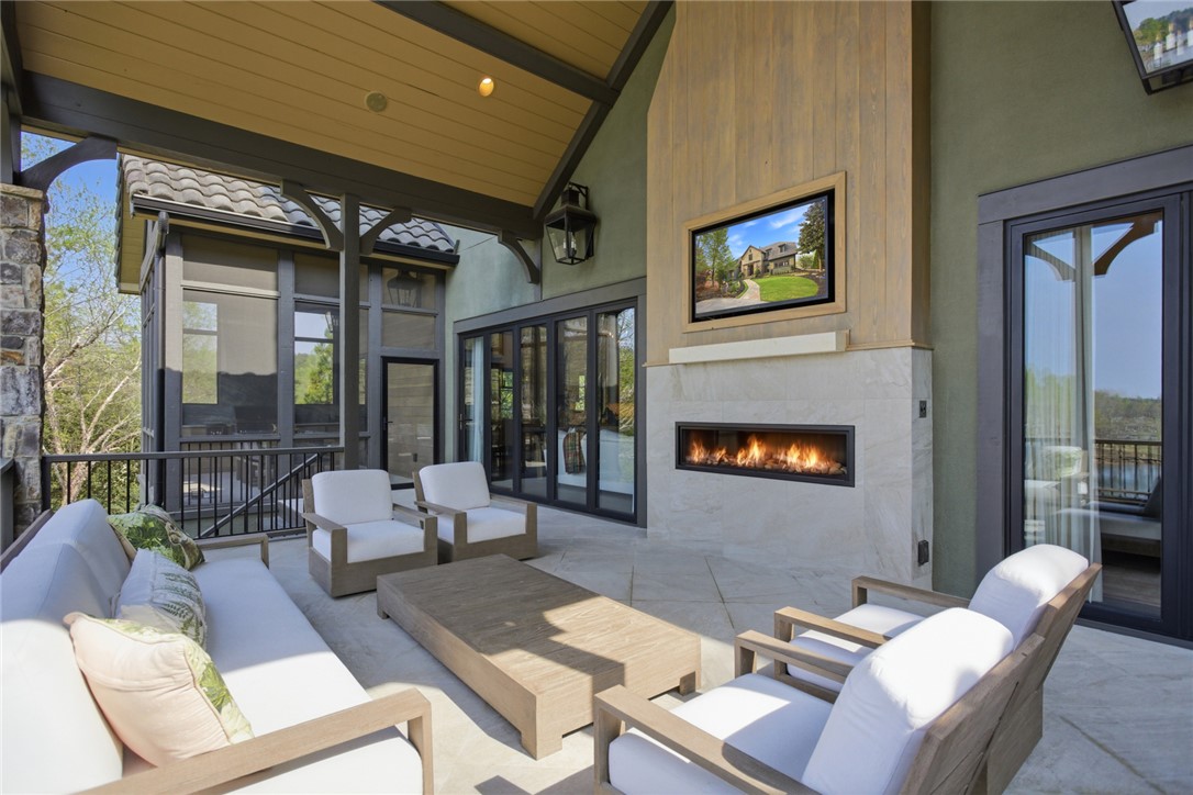 226 Long Ridge Road Sunset, SC 29685 - Photo 13 of 50 An inviting outdoor patio offers a cozy fireplace, perfect for serene evenings and entertaining.