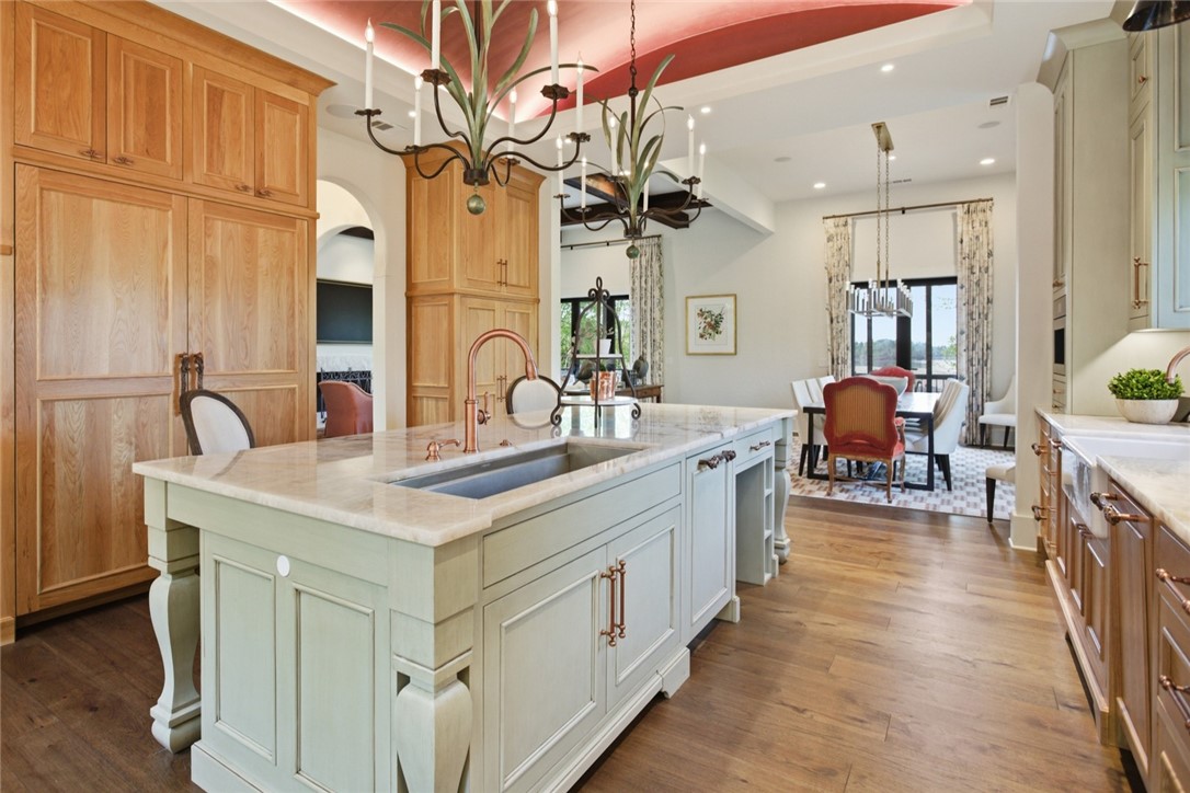 226 Long Ridge Road Sunset, SC 29685 - Photo 20 of 50 This spacious kitchen offers ample storage, an island with a sink, and hardwood flooring.