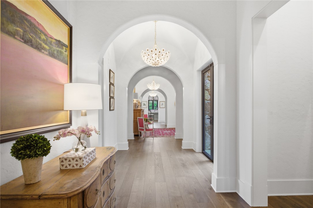 226 Long Ridge Road Sunset, SC 29685 - Photo 23 of 50 This spacious hallway features elegant arched doorways and glistening chandeliers.