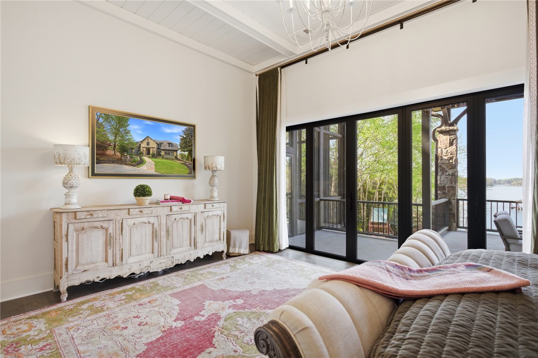 226 Long Ridge Road Sunset, SC 29685 - Photo 25 of 50 This primary bedroom offers ample space, high ceilings, and direct access to an outdoor balcony.