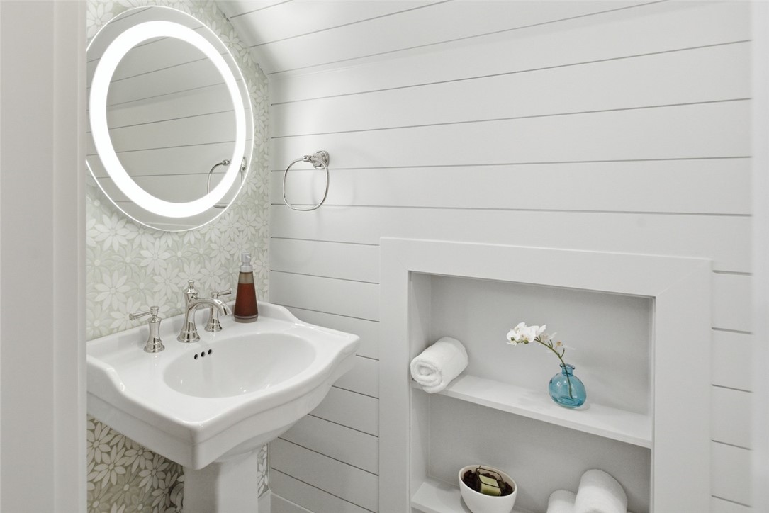 226 Long Ridge Road Sunset, SC 29685 - Photo 32 of 50 This clean and inviting bathroom features a pedestal sink and bright, functional lighting.