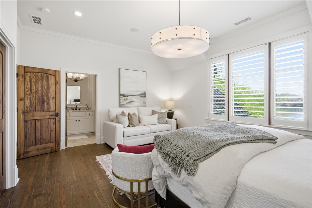 226 Long Ridge Road Sunset, SC 29685 - Photo 36 of 50 This inviting bedroom features rich hardwood flooring and bright windows, offering a serene personal retreat.