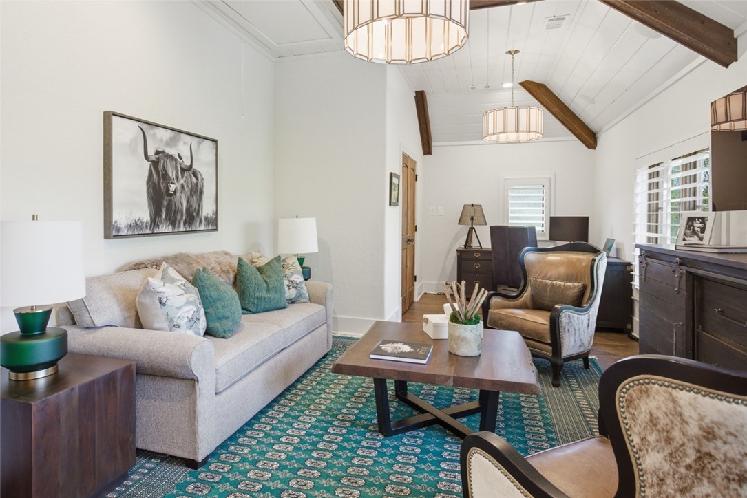226 Long Ridge Road Sunset, SC 29685 - Photo 38 of 50 This inviting space features high vaulted ceilings and exposed wood beams, creating an airy and warm ambiance.