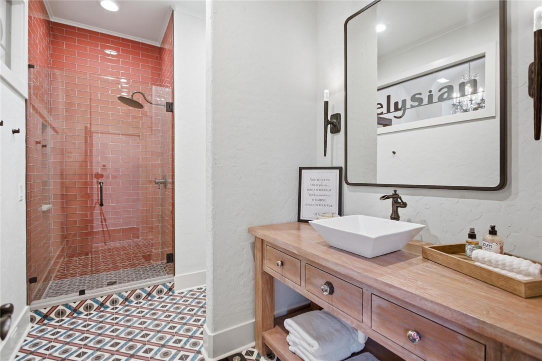 226 Long Ridge Road Sunset, SC 29685 - Photo 39 of 50 This bathroom features a contemporary vanity and a spacious glass-enclosed shower with vibrant tile.