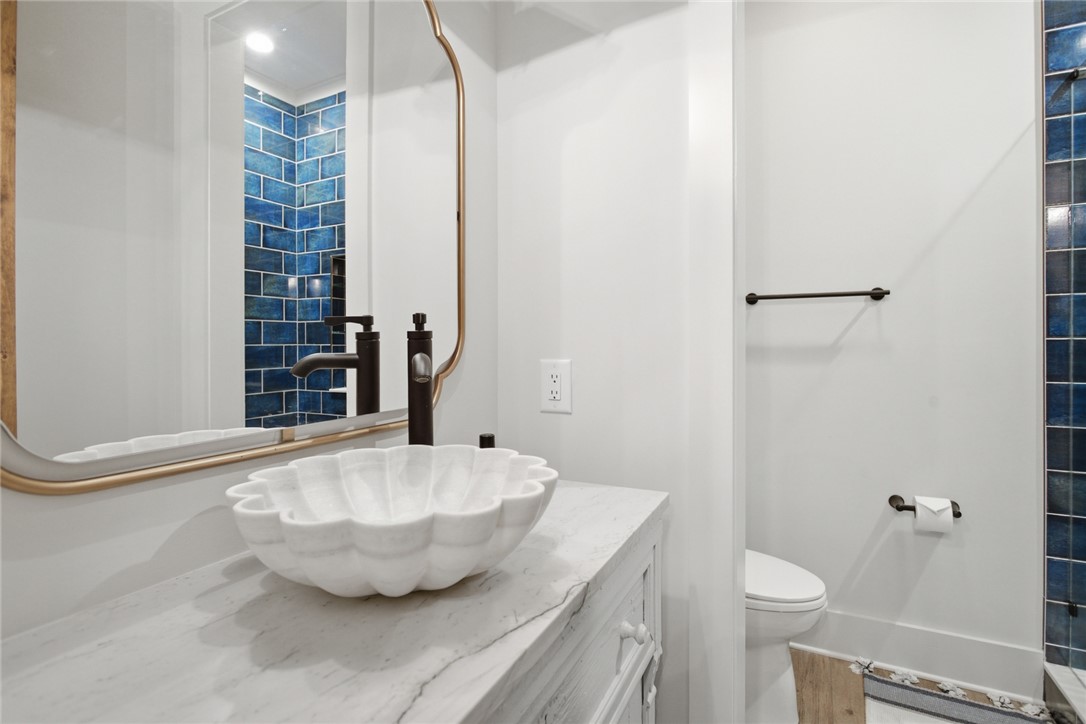 226 Long Ridge Road Sunset, SC 29685 - Photo 43 of 50 This bathroom features a unique sink basin and striking blue tiled accents.
