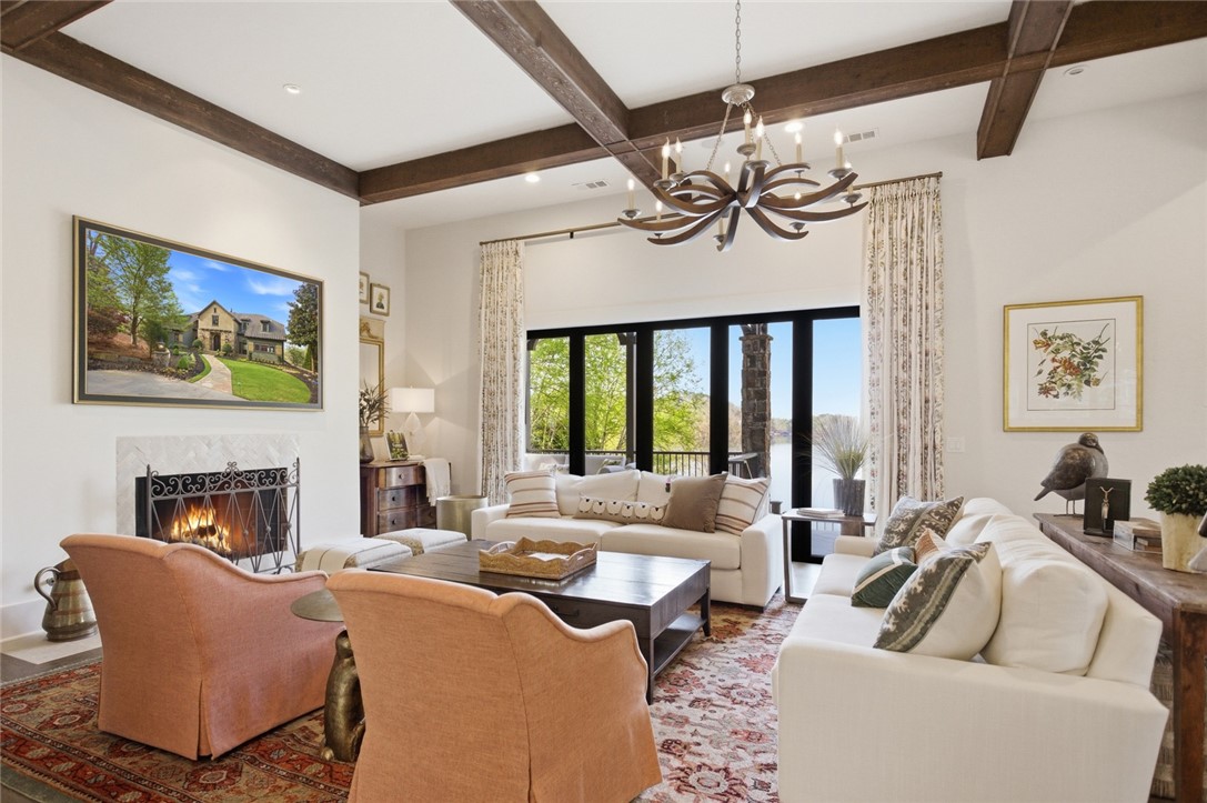 226 Long Ridge Road Sunset, SC 29685 - Photo 8 of 50 This living room offers an inviting ambiance with exposed beams and a captivating view.