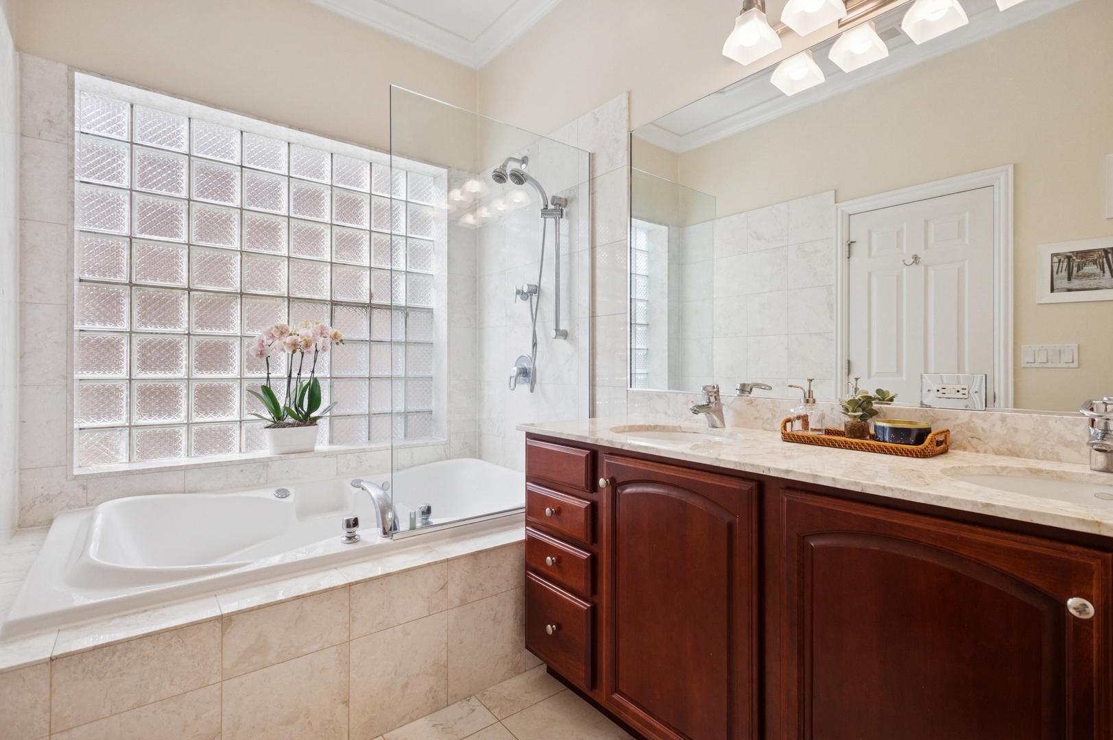 3331 North Seminary Avenue, Unit 3 Chicago, IL 60657 - Photo 7 of 19 a bathroom with a granite countertop sink mirror and a bathtub