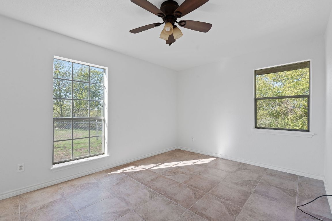 130 Meyers Road Buda, TX 78610 - Photo 15 of 35 a view of an empty room with a window
