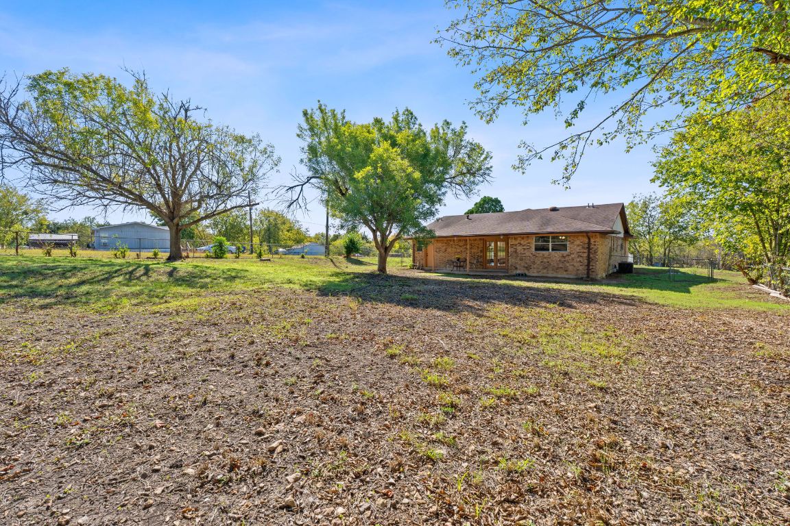 130 Meyers Road Buda, TX 78610 - Photo 21 of 35 a view of yard with tree and green space