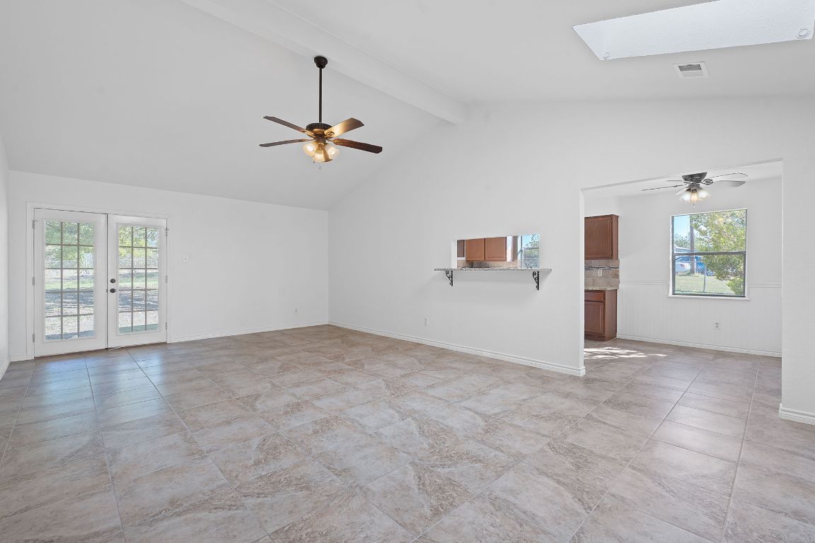 130 Meyers Road Buda, TX 78610 - Photo 4 of 35 an empty room with windows and ceiling fan
