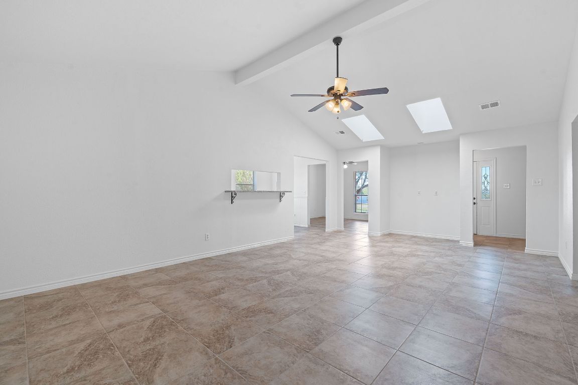 130 Meyers Road Buda, TX 78610 - Photo 6 of 35 a view of an empty room with a ceiling fan