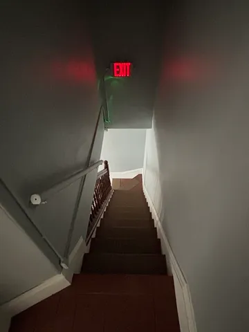 a view of staircase with white walls